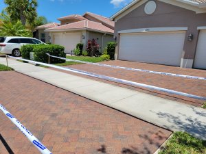 Skilled technician from Peters Pressure Washing applying premium breathable sealer to pool deck pavers in Valrico Florida for long-lasting UV and stain protection