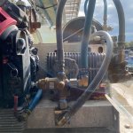 Technician performing full pressure washer equipment inspection in Tampa Bay