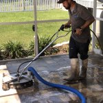 Algae-stained Florida pool cage screen before professional cleaning in Riverview