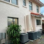 Professional house wash Tampa soft washing removing algae and mildew from home siding by Peter's Pressure Washing